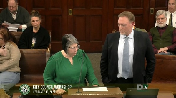 Video screenshot of City Council Feb 18 2026 meeting showing the School Superintendent speaking from the podium